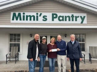 The Bar Plan Foundation presents a donation to Mimi’s Pantry following a Topgolf fundraising event
